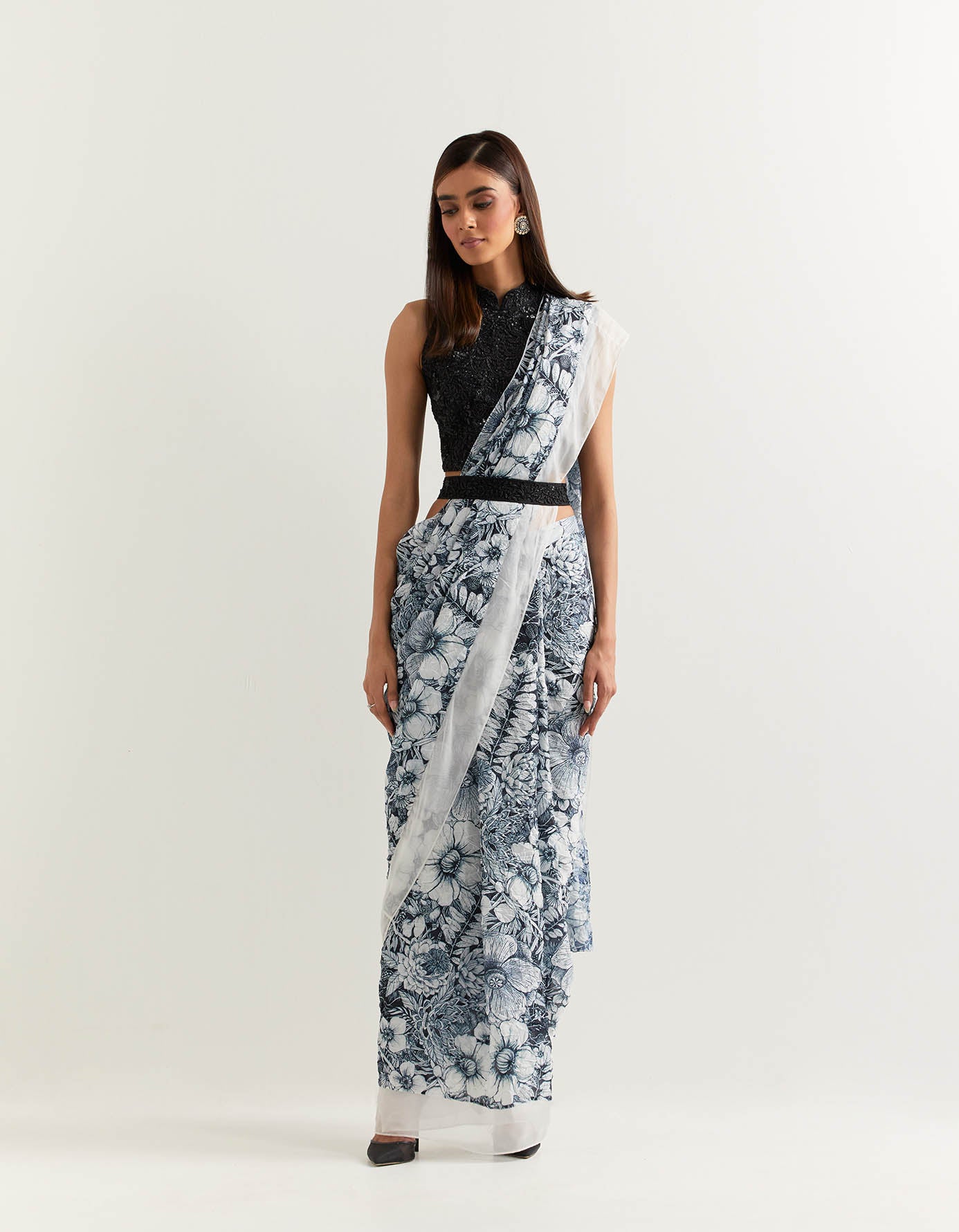 Stretch lycra hand embellished halter blouse paired with crush silk printed pre stitched saree and belt