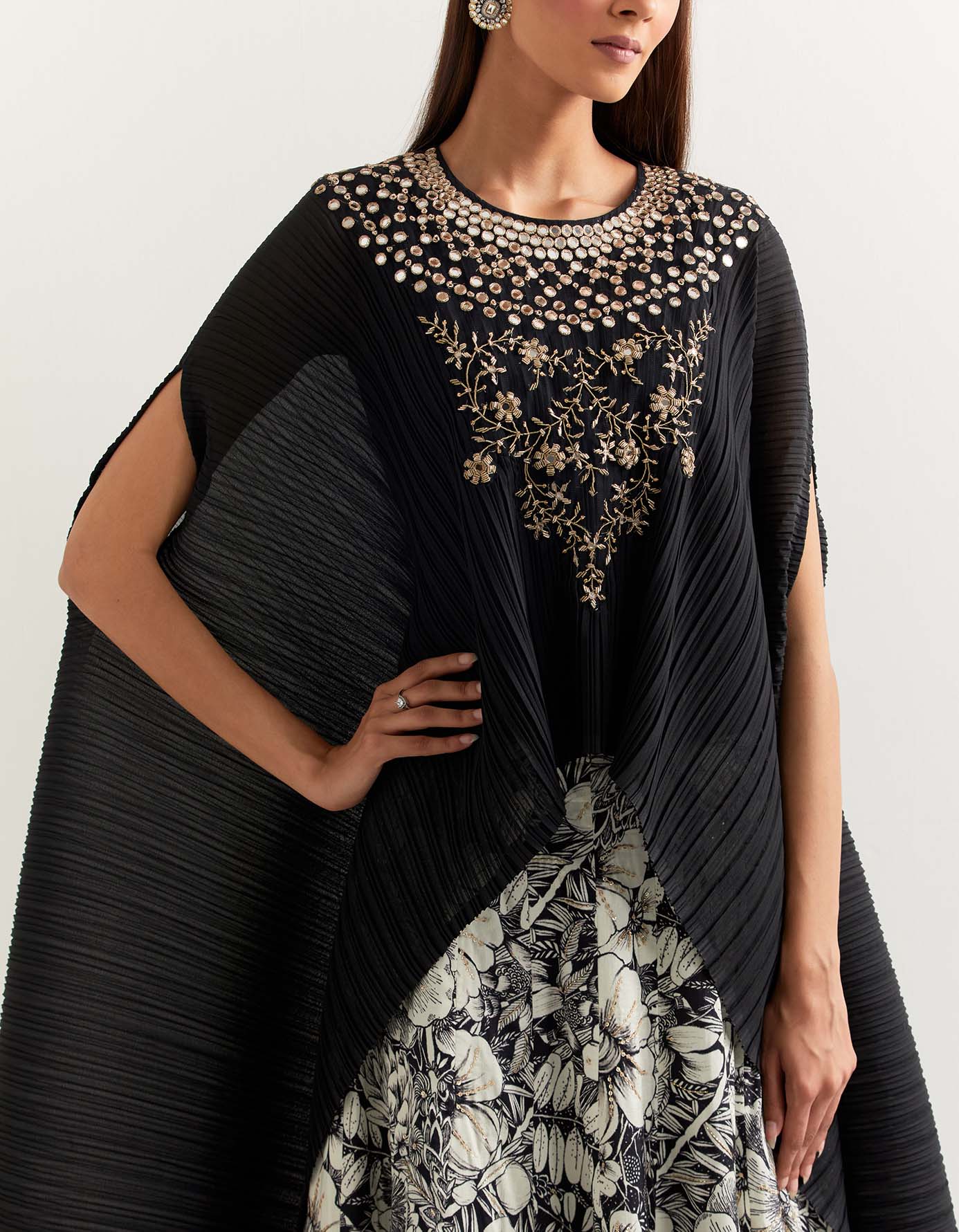 Crinkle georgette cape embellished with hand embroidered neck line paired with panelled printed skirt
