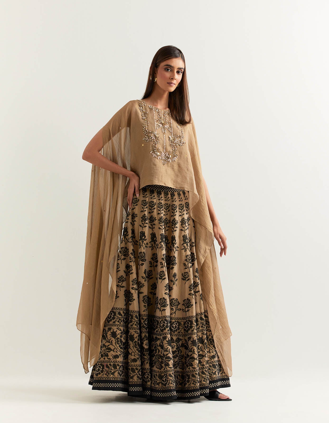 Chanderi tissue hand embellished dupatta cape paired with cross stitch rose embroidered skirt