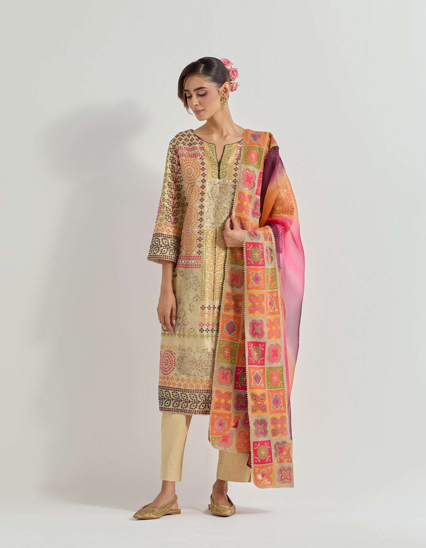 Resham and hand embellished kurta in tiisue paired with stretch lycra pants and organza silk tie dye dupatta