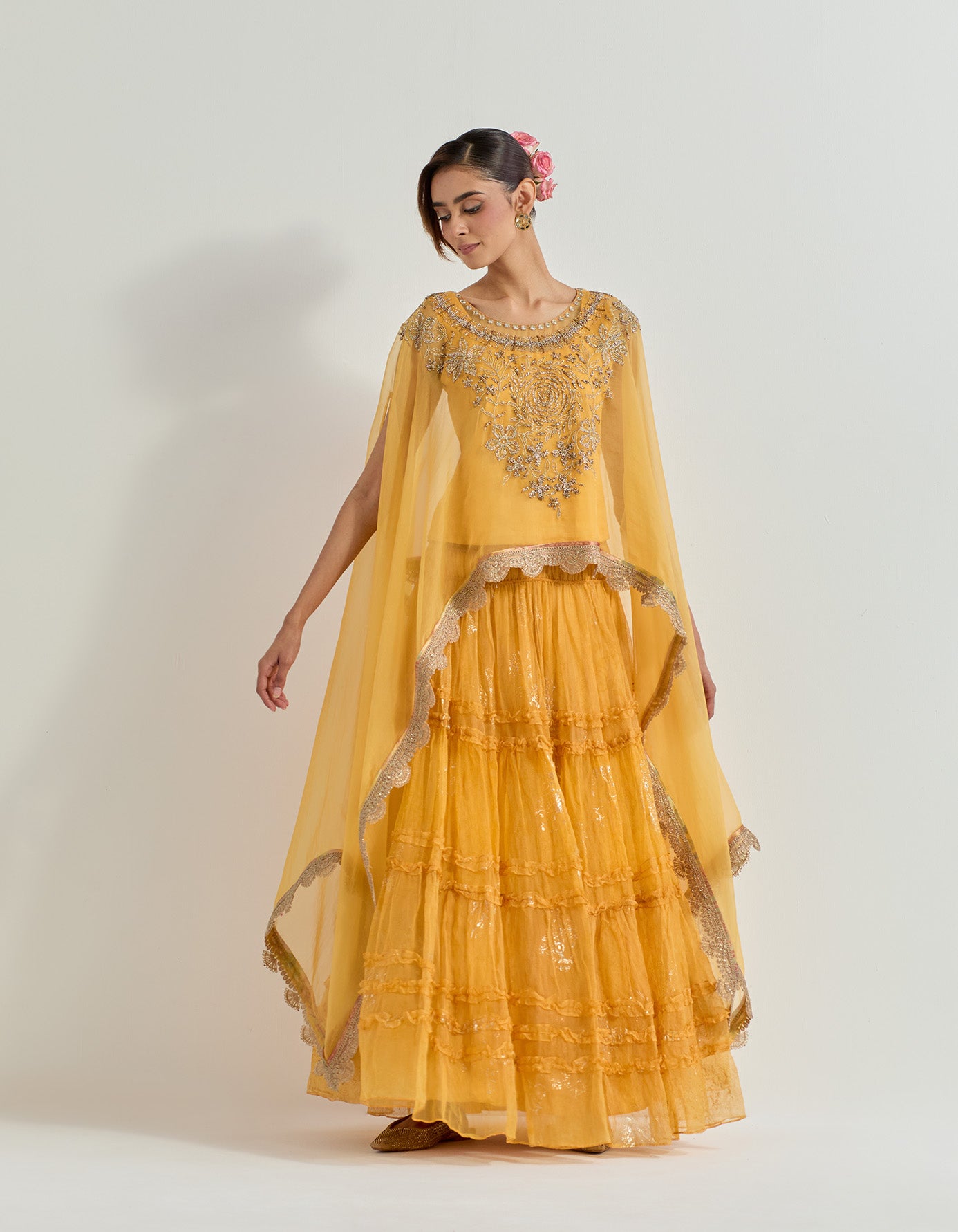 Hand embellished organza dupatta cape paired with tiered organza foil printed skirt with ruffle detail