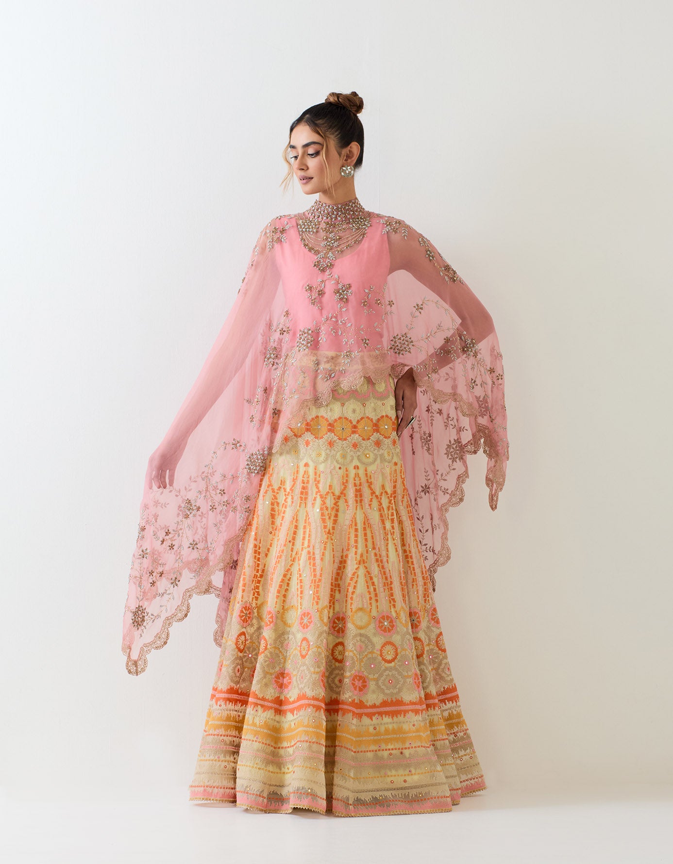 Organza scallop hand embroidered cape paired with organza skirt in bandhini motif