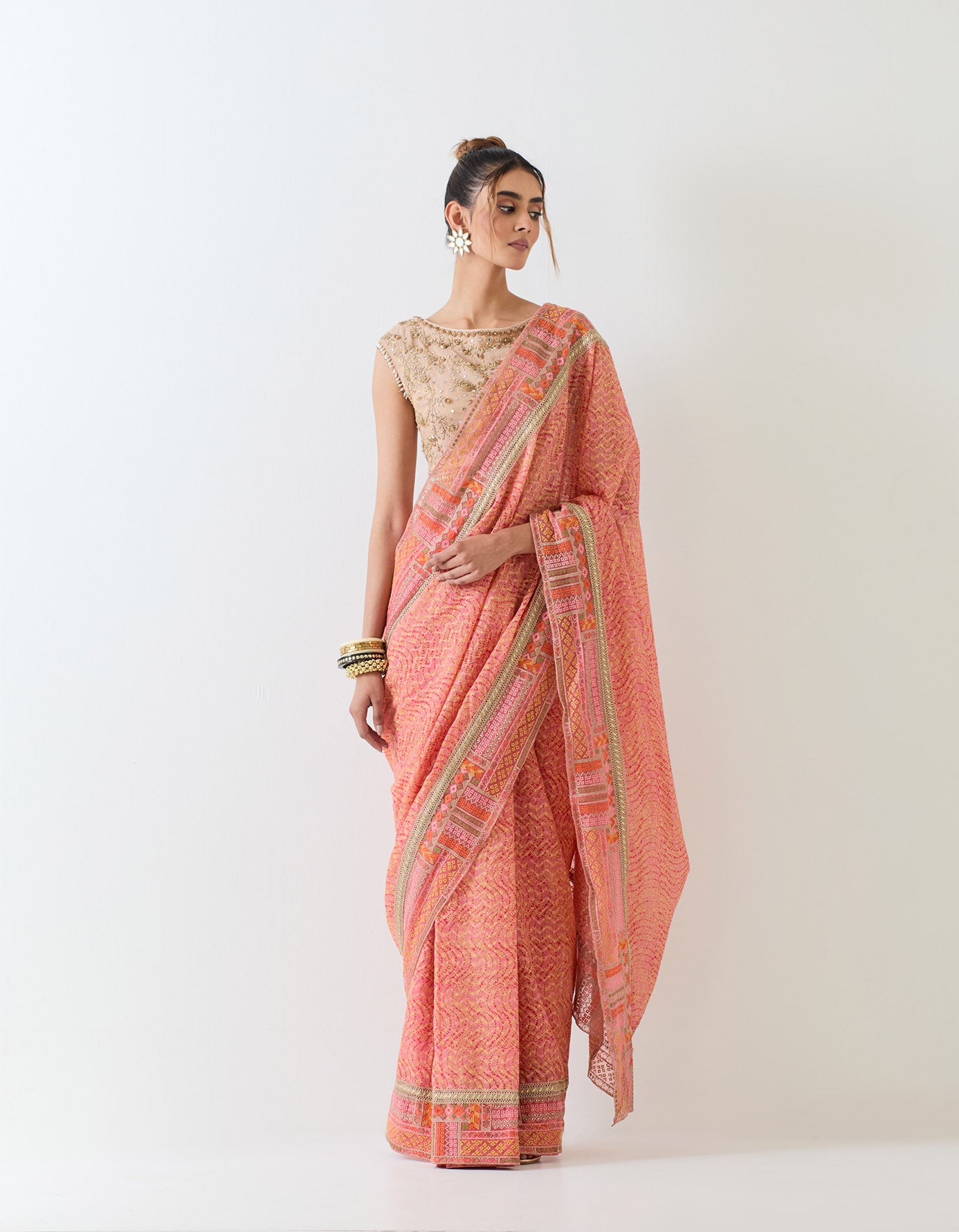 Tissue hand embellished blouse paired with silk jaquard printed pre stitched saree with cross stitch border