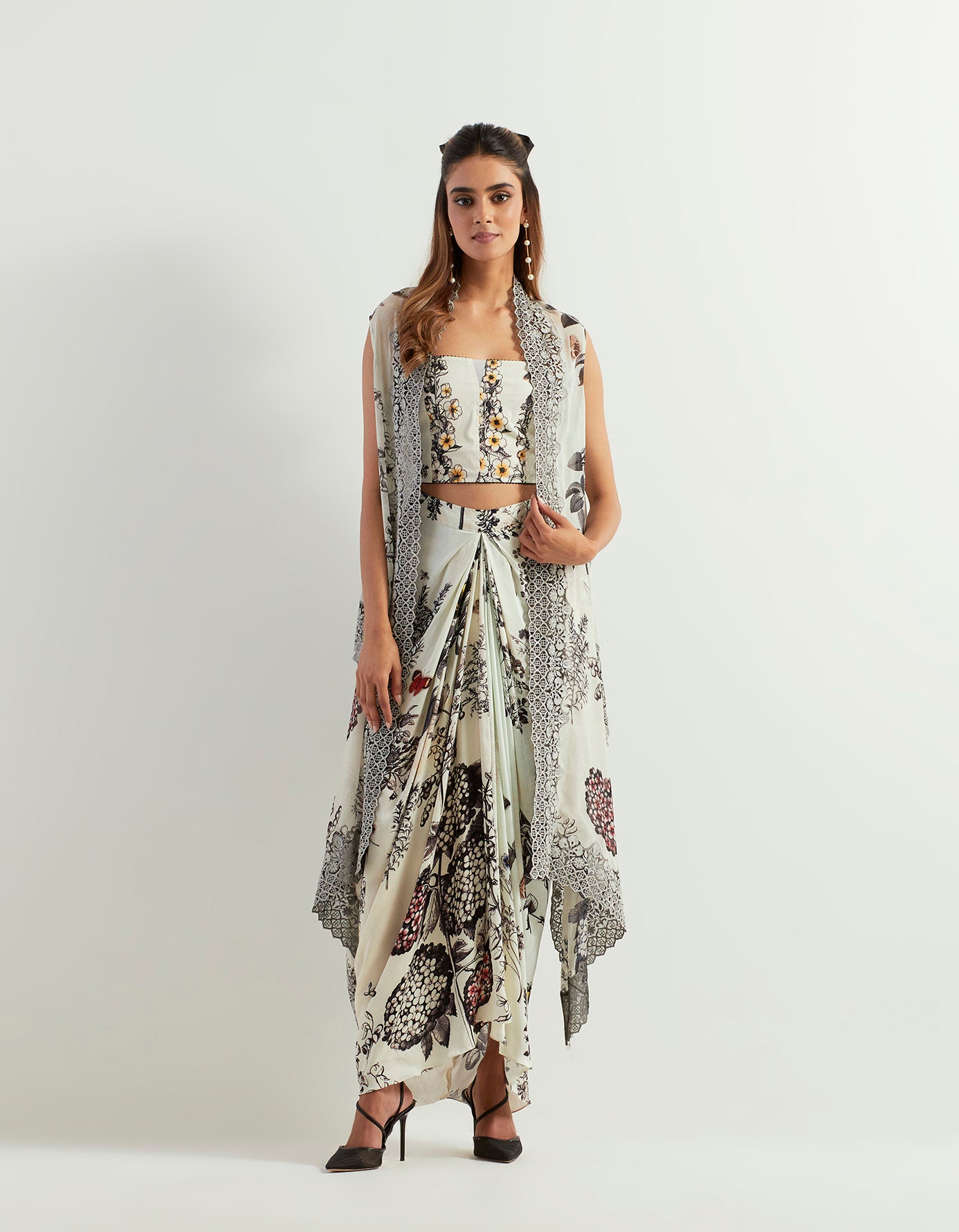 Saaya printed cape with lace borders paired with stretch bustier and drape skirt in satin
