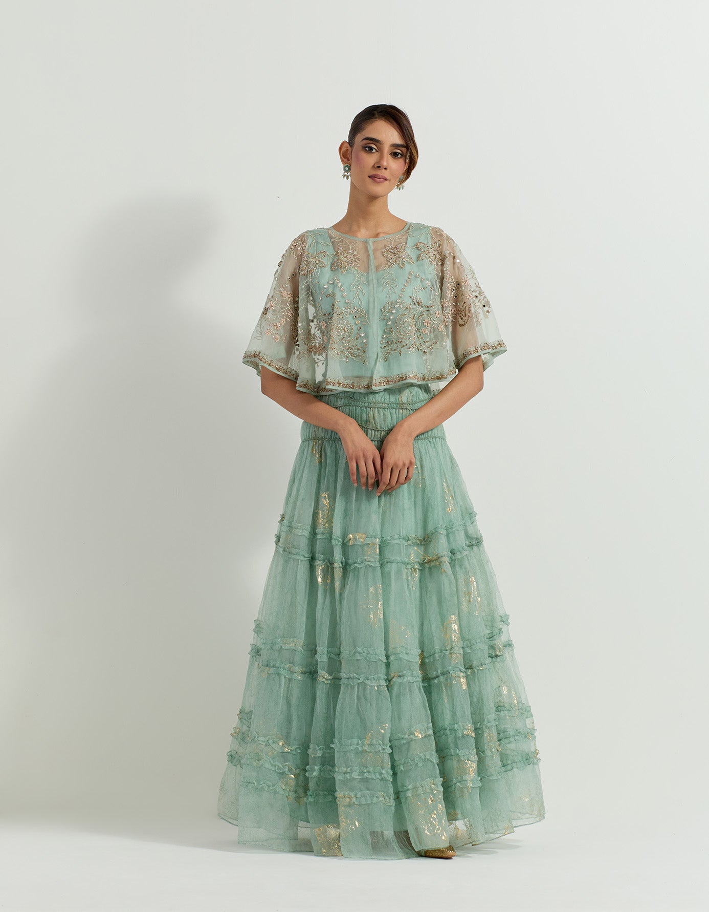 Hand embellished organza circular cape paired with tiered organza foil printed skirt with ruffle detail