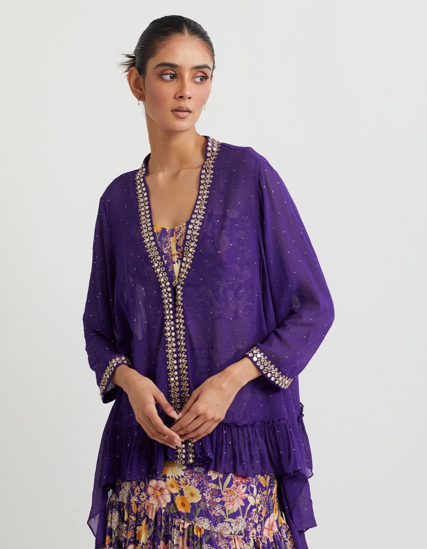 Printed tiered skirt paired with front open jacket with mirror work