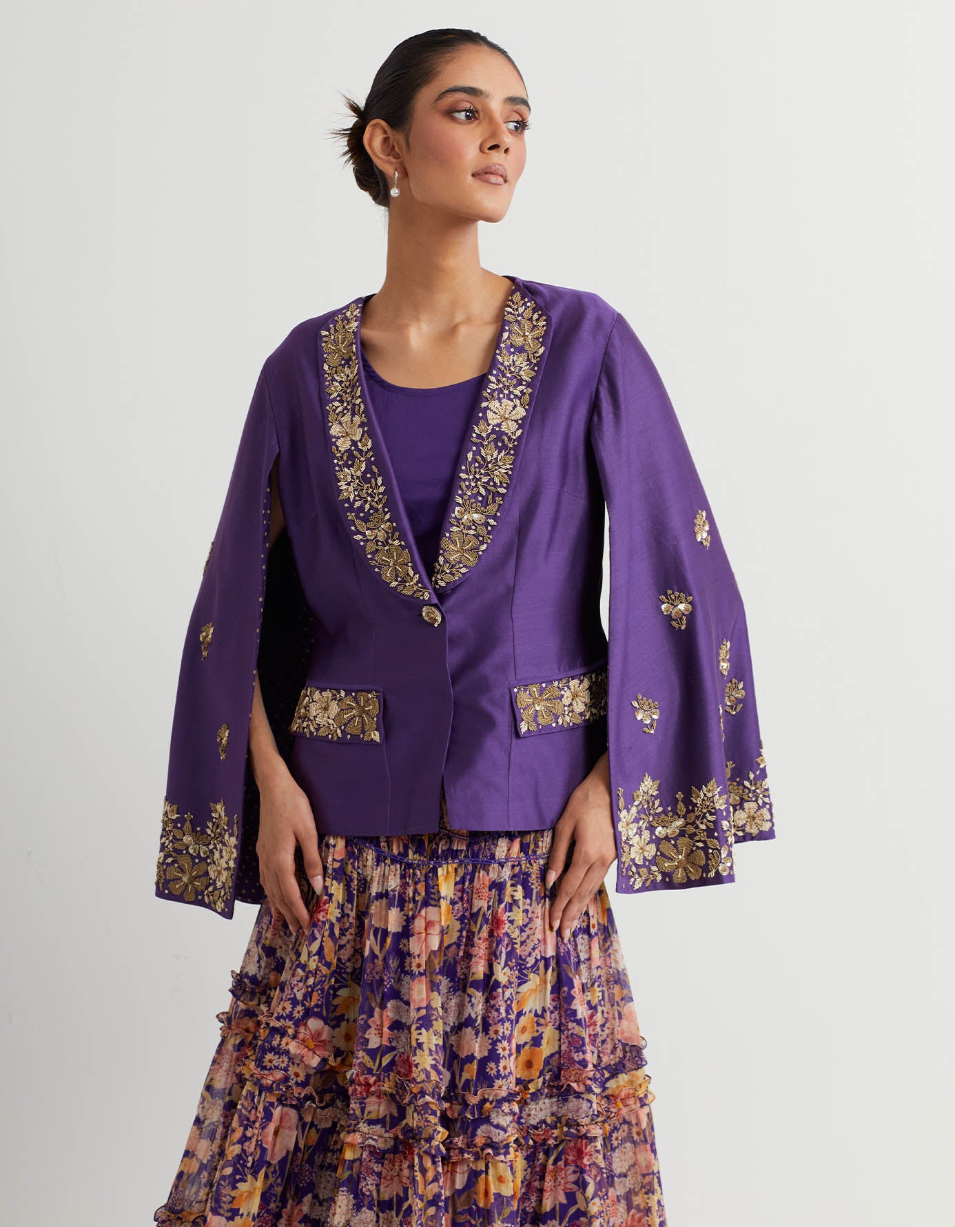 Printed tiered skirt paired with cape sleeves hand embroidered jacket