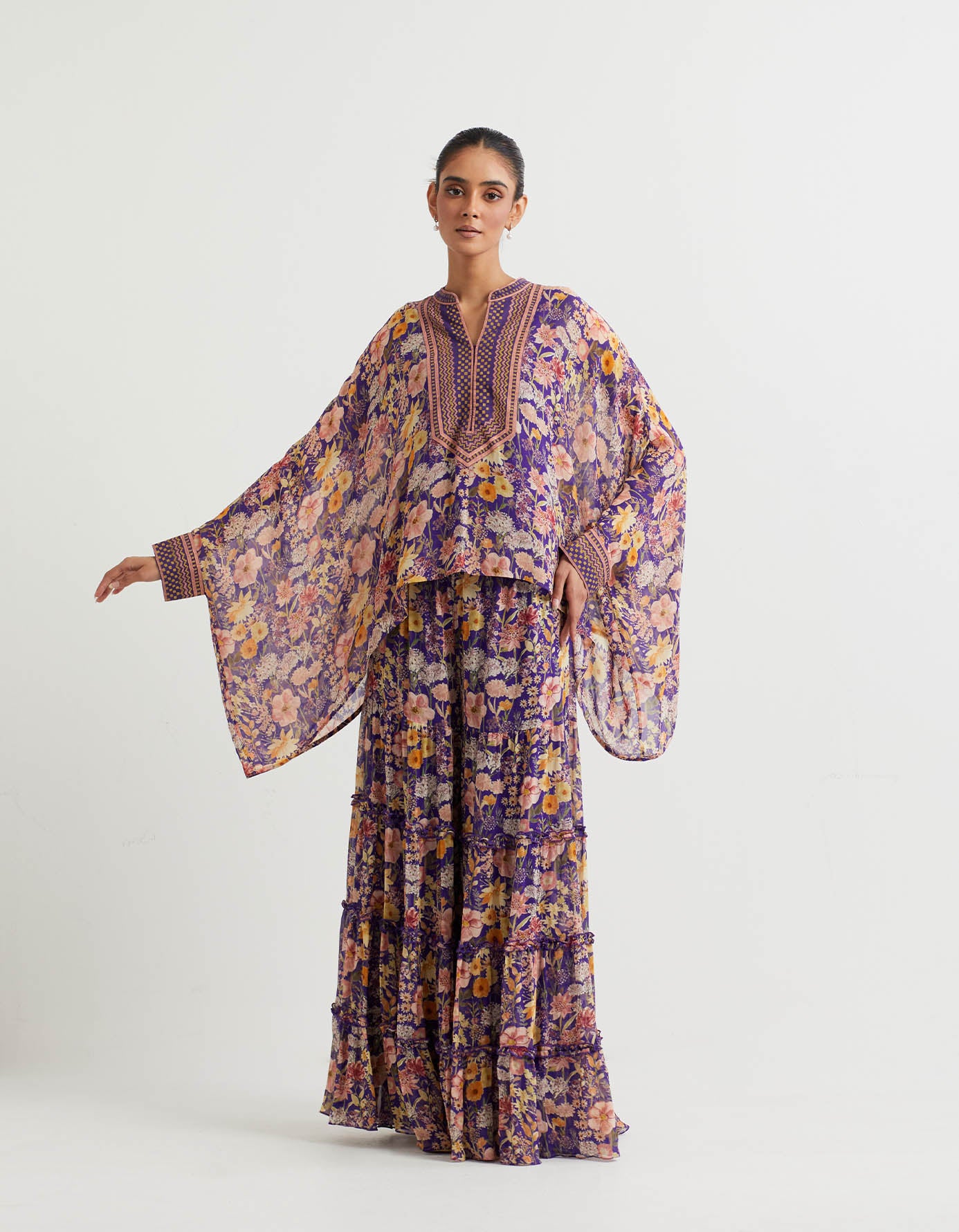 Printed tiered sharara with ruffle detail paired with printed cape
