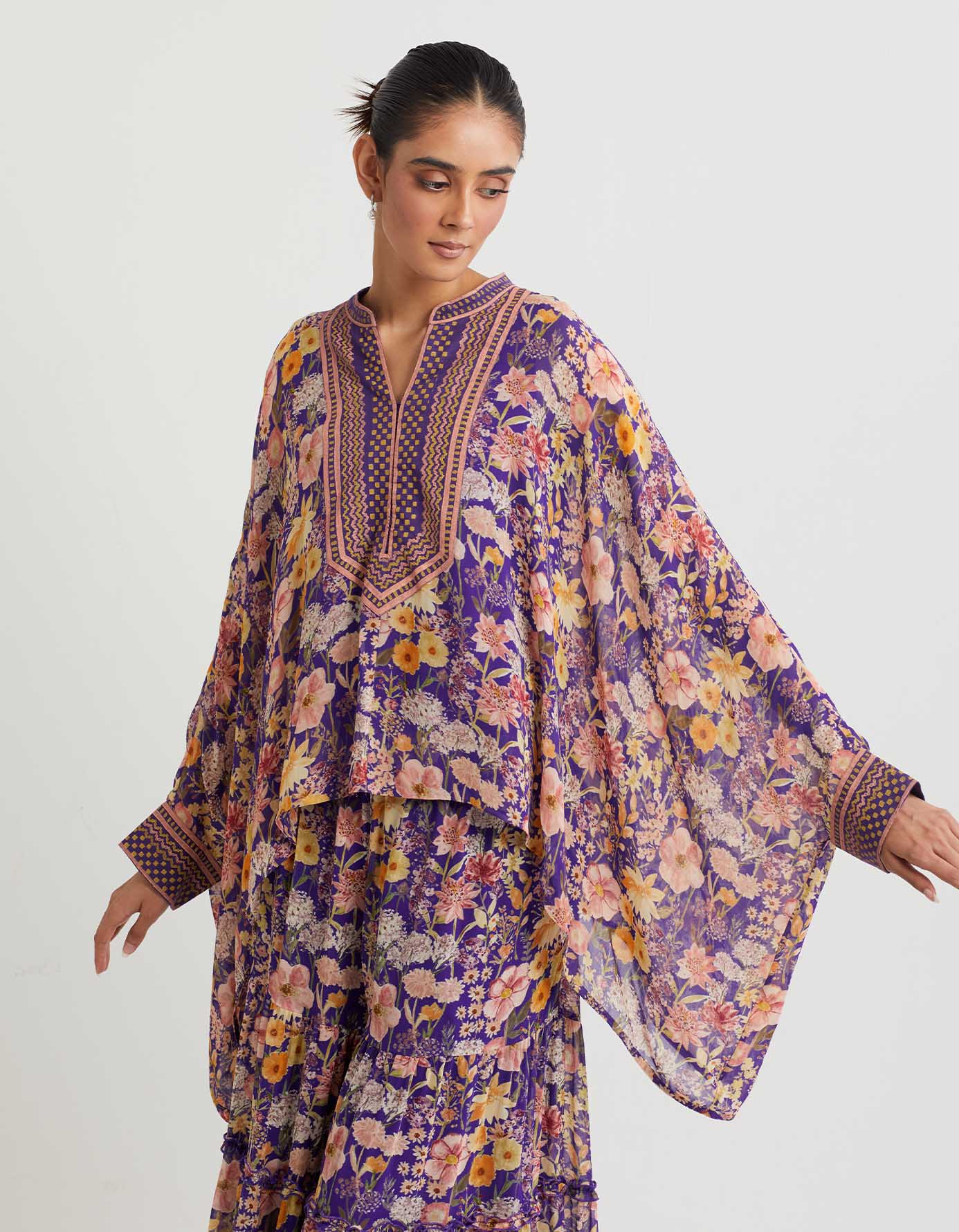 Printed tiered sharara with ruffle detail paired with printed cape
