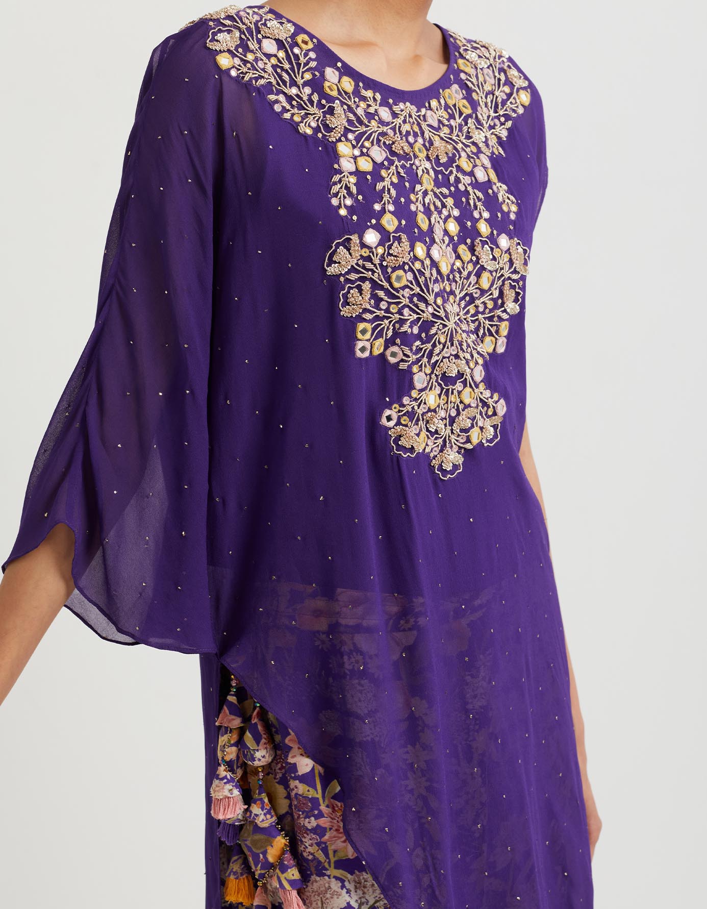 Printed gathered sharara paired with asymmetric hand embroidered cape