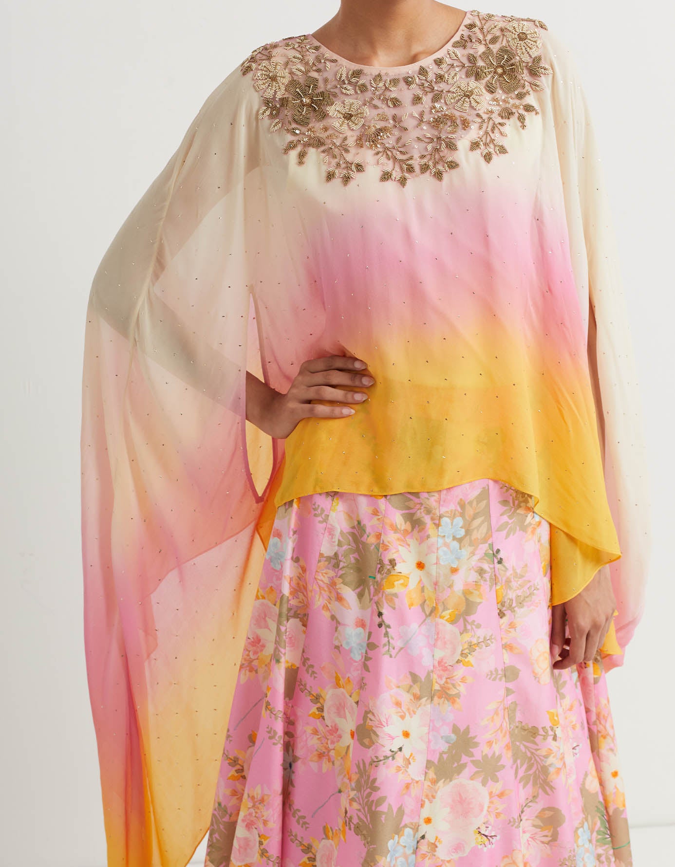 Printed panelled lehnga with pleated border paired with ombre dupatta cape with heavy hand embroidered neckline