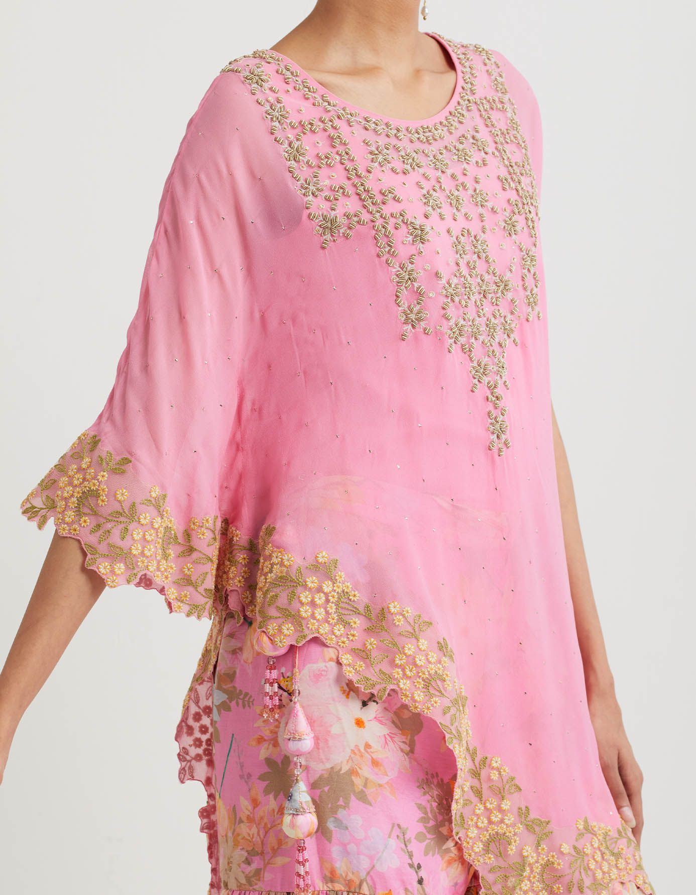 Printed gathered sharara paired with asymetric hand embroidered cape