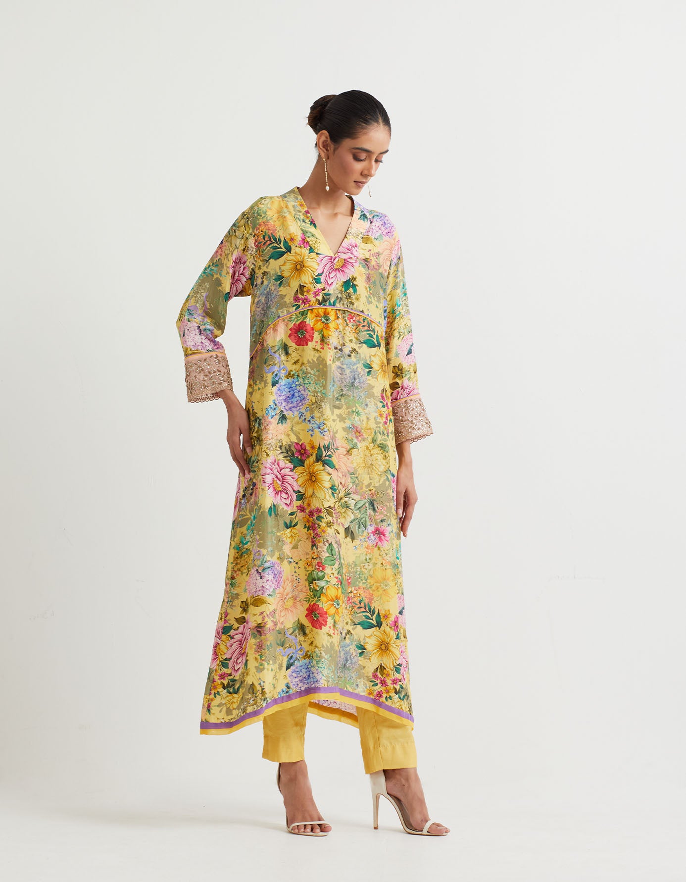 Printed pure silk a line kurta with hand embroidered  cuffs paired modal silk narrow pants.