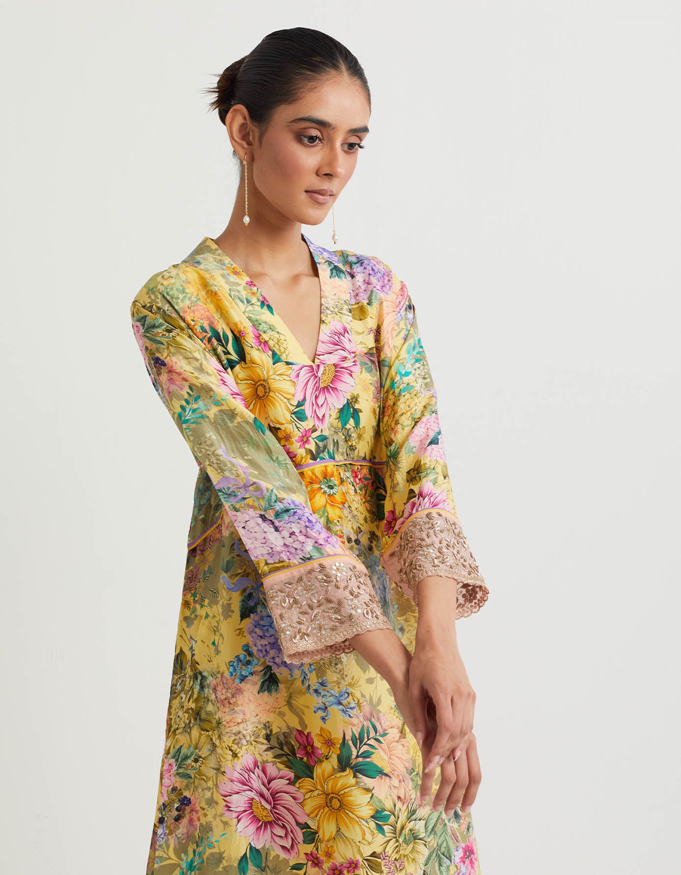Printed pure silk a line kurta with hand embroidered  cuffs paired modal silk narrow pants.