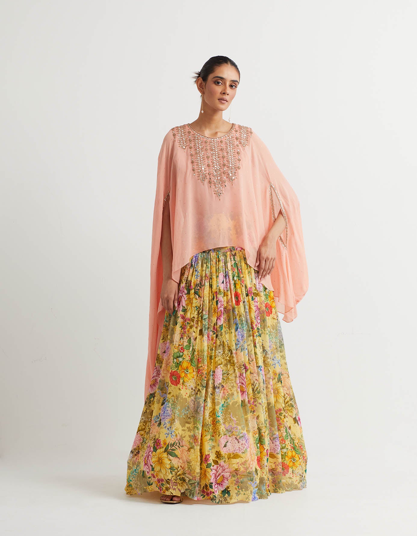 Printed gathered lehnga paired with embroidered dupatta cape