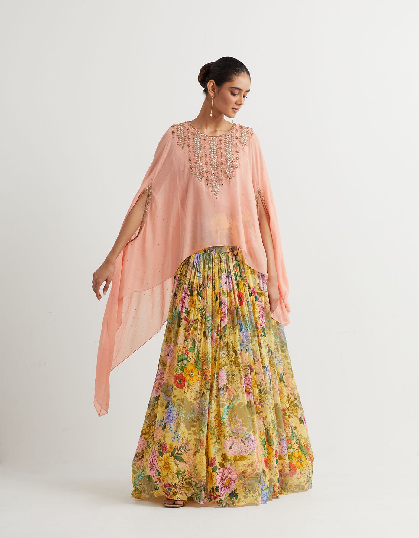 Printed gathered lehnga paired with embroidered dupatta cape