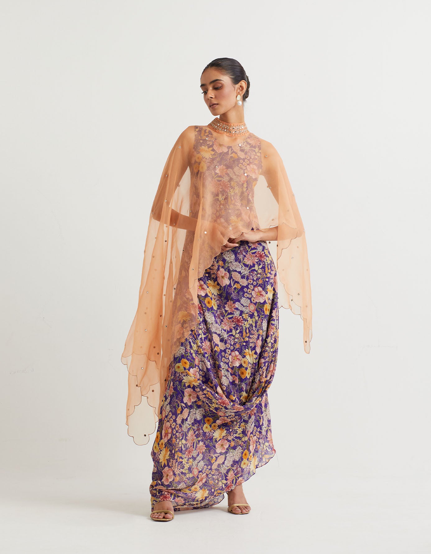 Printed cowl dress paired with dupatta cape with hand embroidery and gold zari scallop border