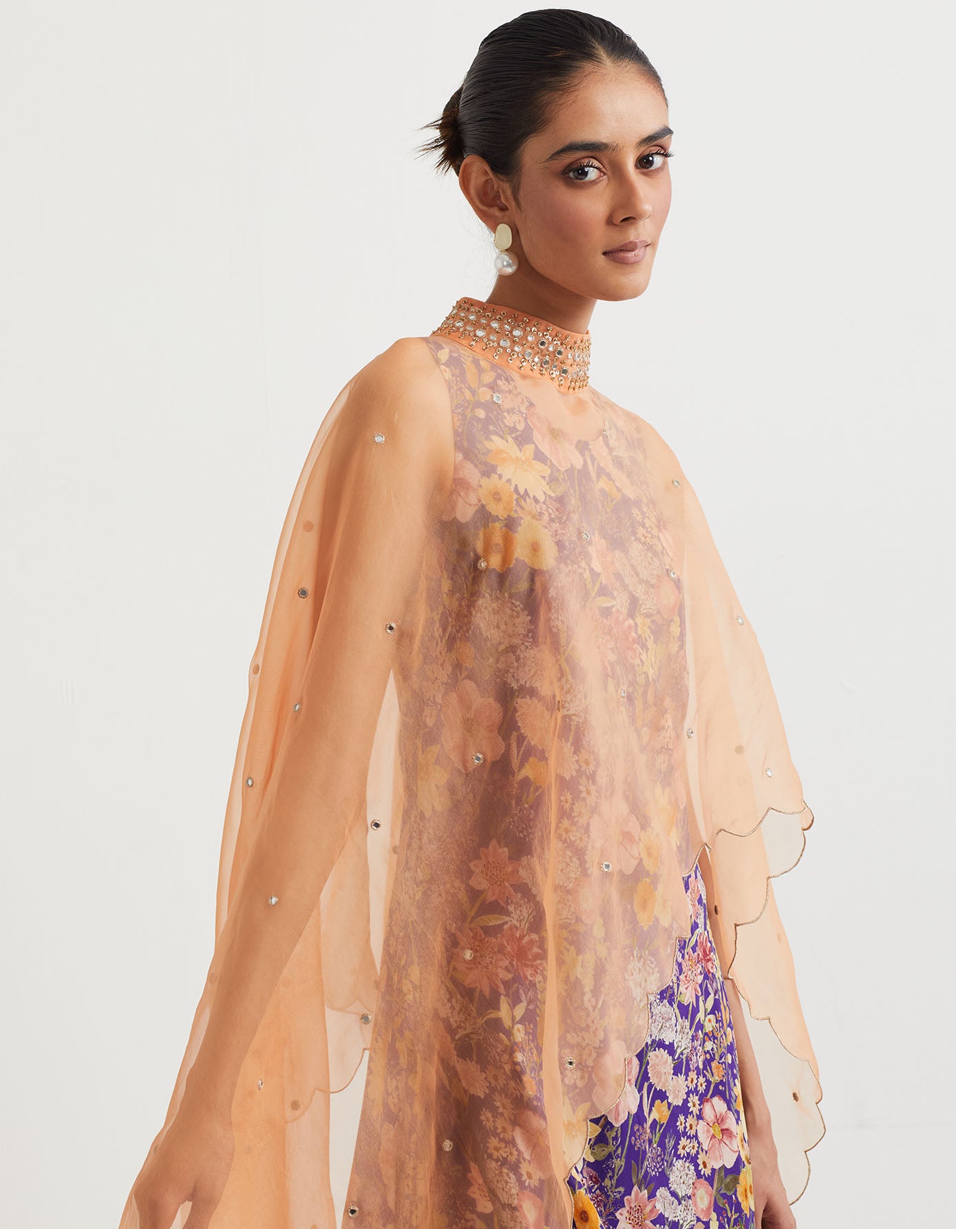 Printed cowl dress paired with dupatta cape with hand embroidery and gold zari scallop border