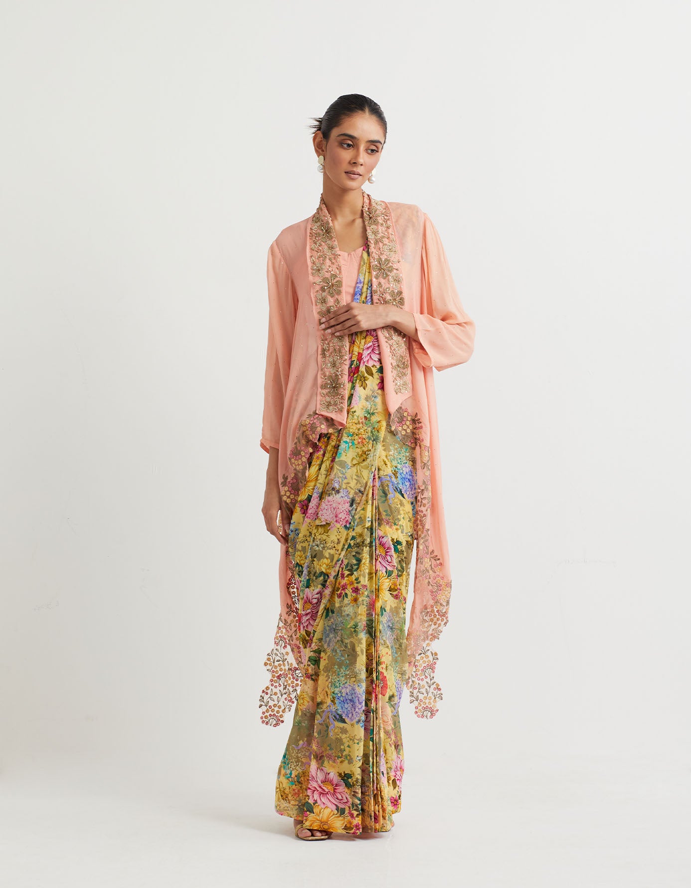 Printed pre-stitchd saree paired with shawl collar embroidered cape