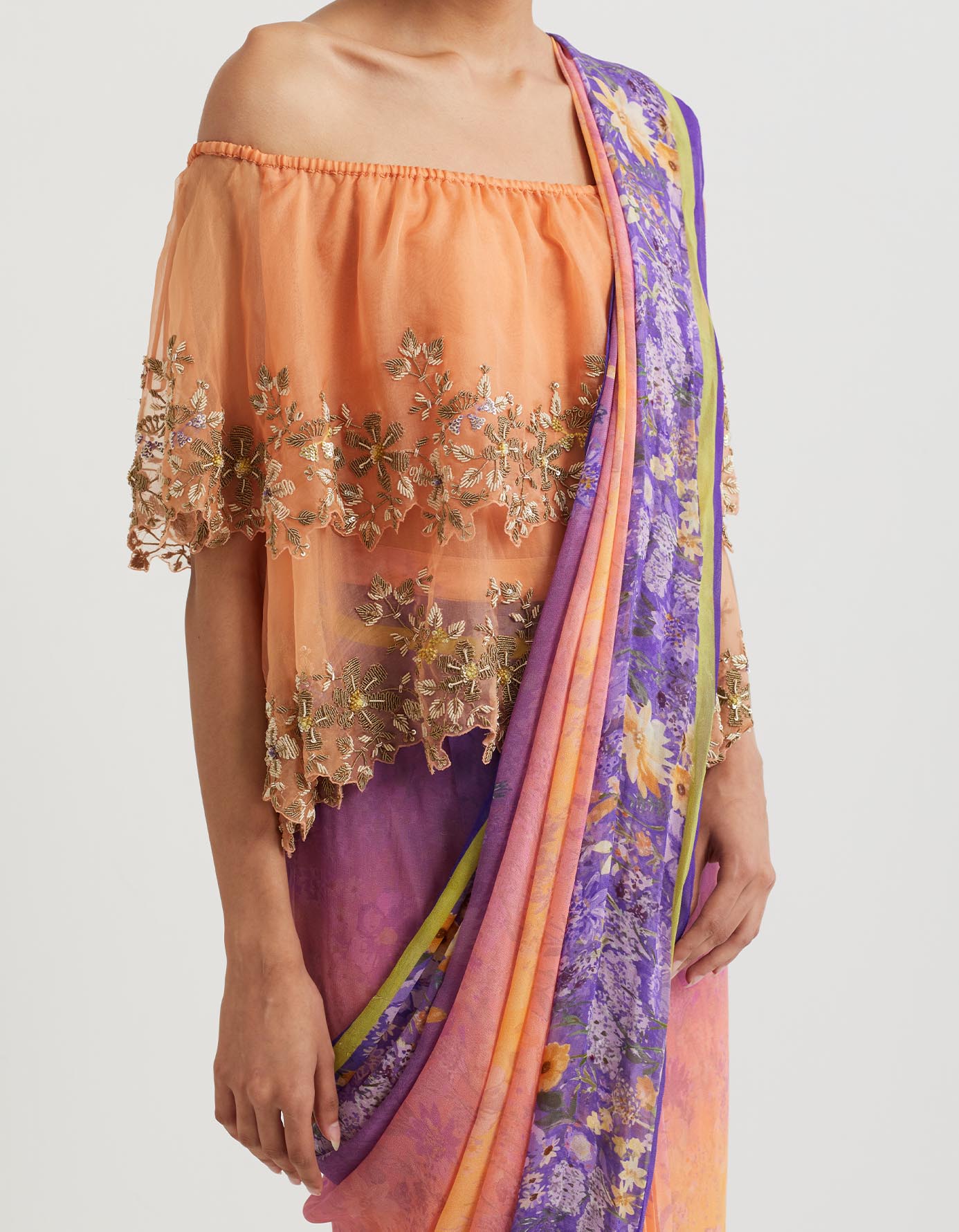 Printed pre-stitchd saree paired with organza off shoulder double layered cape in zardozi embroidery