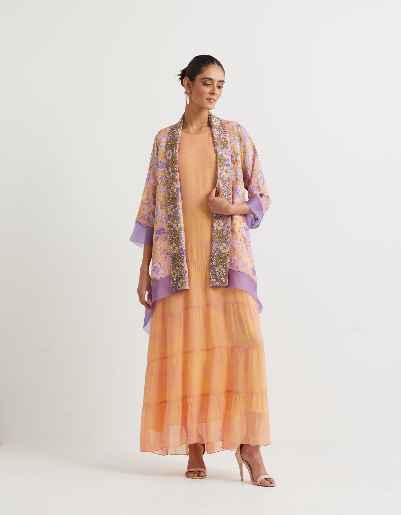 Chapka printed tiered dress paired with embroidered and printed shawl collar cape