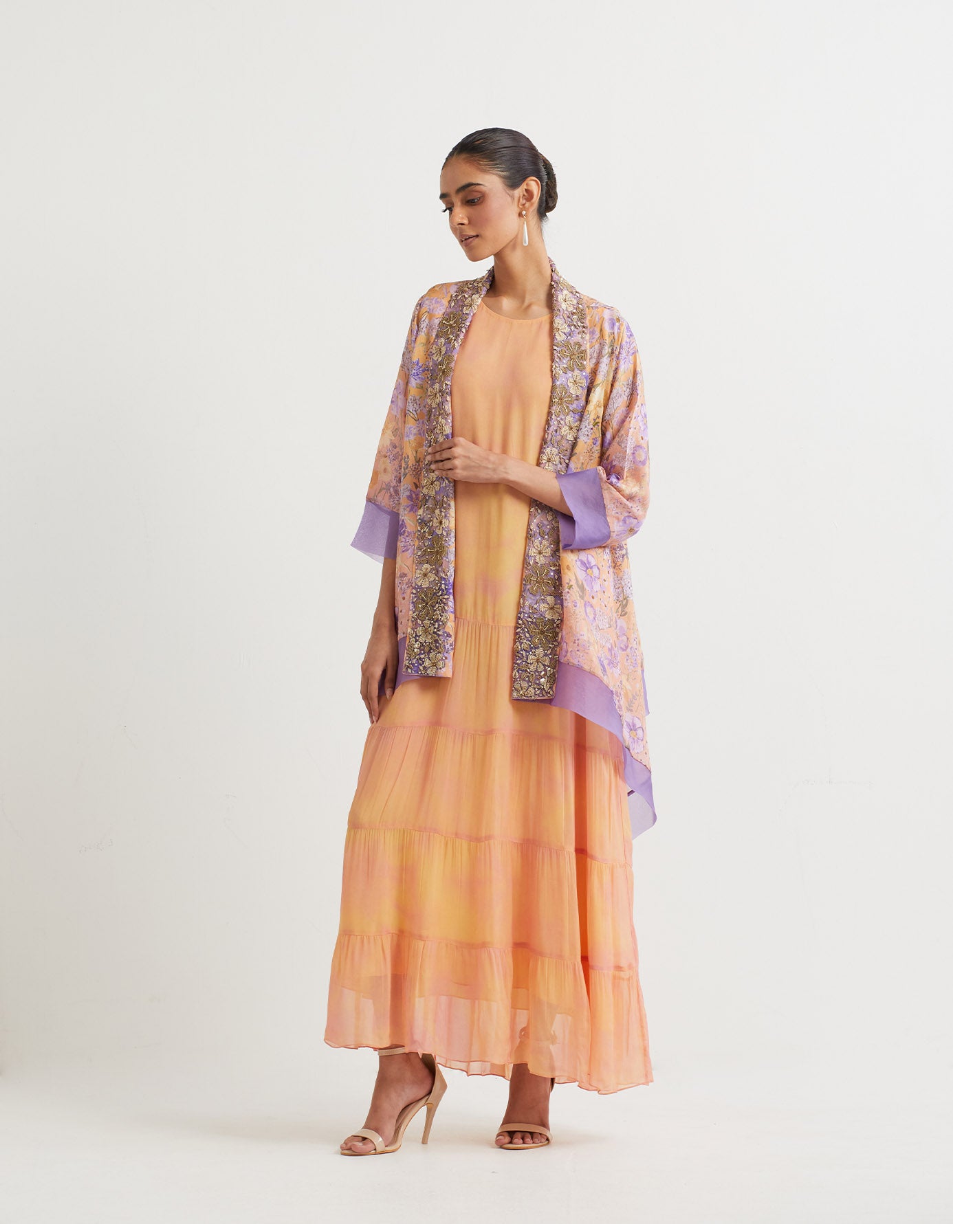 Chapka printed tiered dress paired with embroidered and printed shawl collar cape