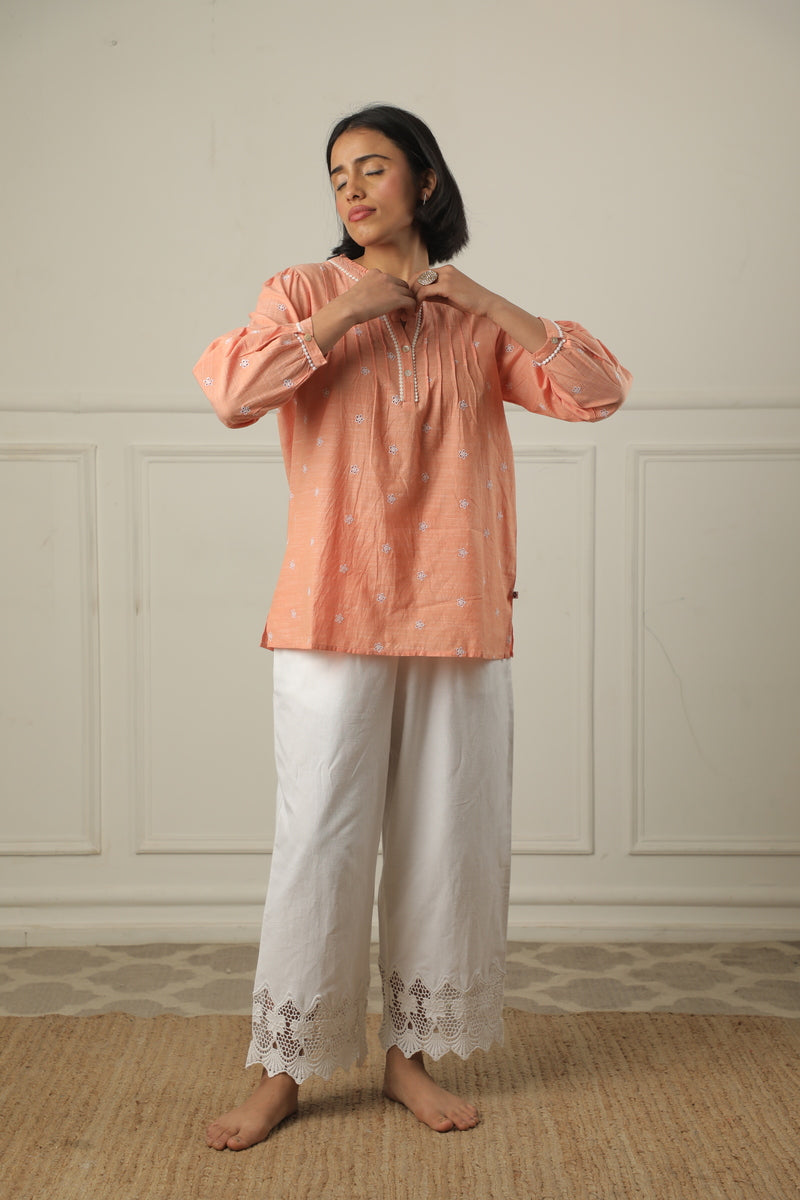 A Top Adorned With Delicate Embroidery