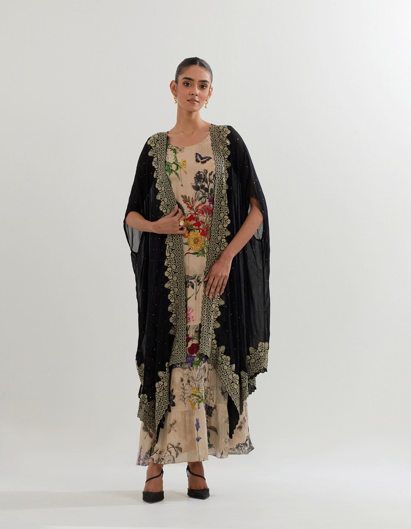 Botanical printed tiered dress paired with cape with resham embroideered border