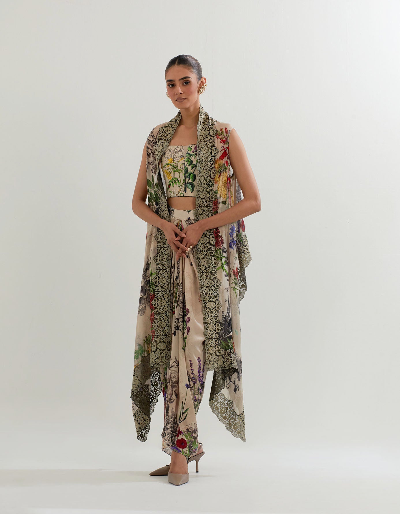 Botanical printed drape skirt paired with stretch bustier and printed cape