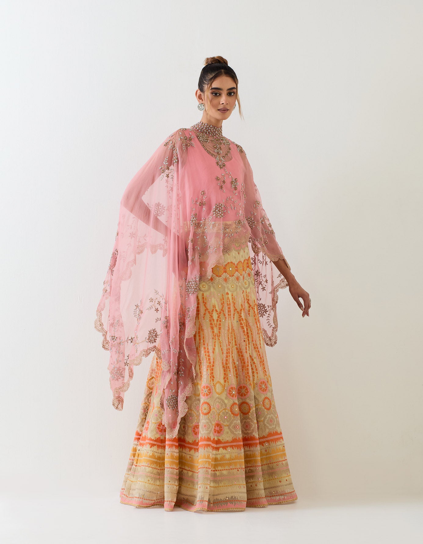 Organza scallop hand embroidered cape paired with organza skirt in bandhini motif