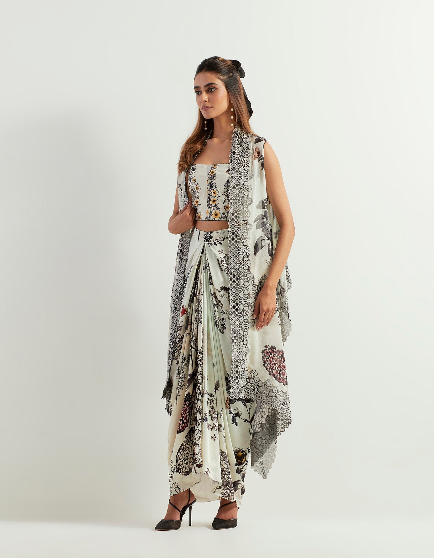 Saaya printed cape with lace borders paired with stretch bustier and drape skirt in satin