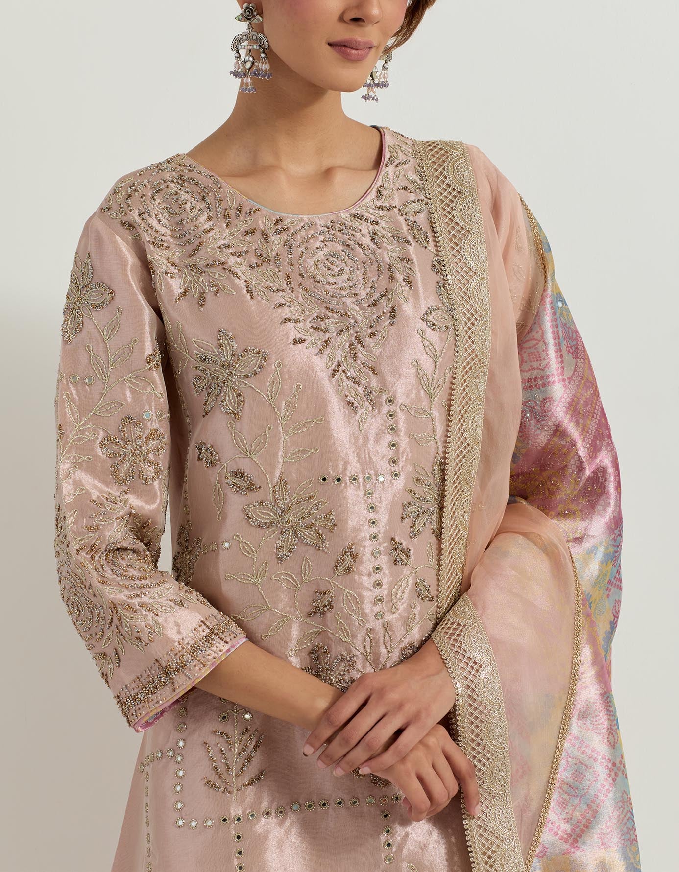 Tissue hand embellished long tunic paired with tissue bandhini printed pleated sharara and organza and tissue patch work dupatta