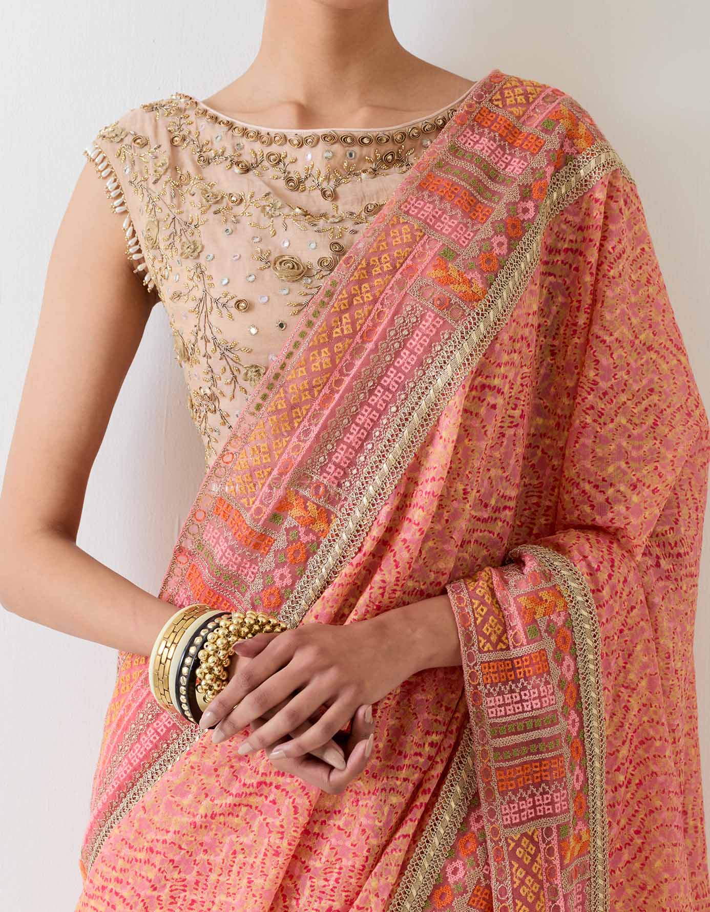 Tissue hand embellished blouse paired with silk jaquard printed pre stitched saree with cross stitch border