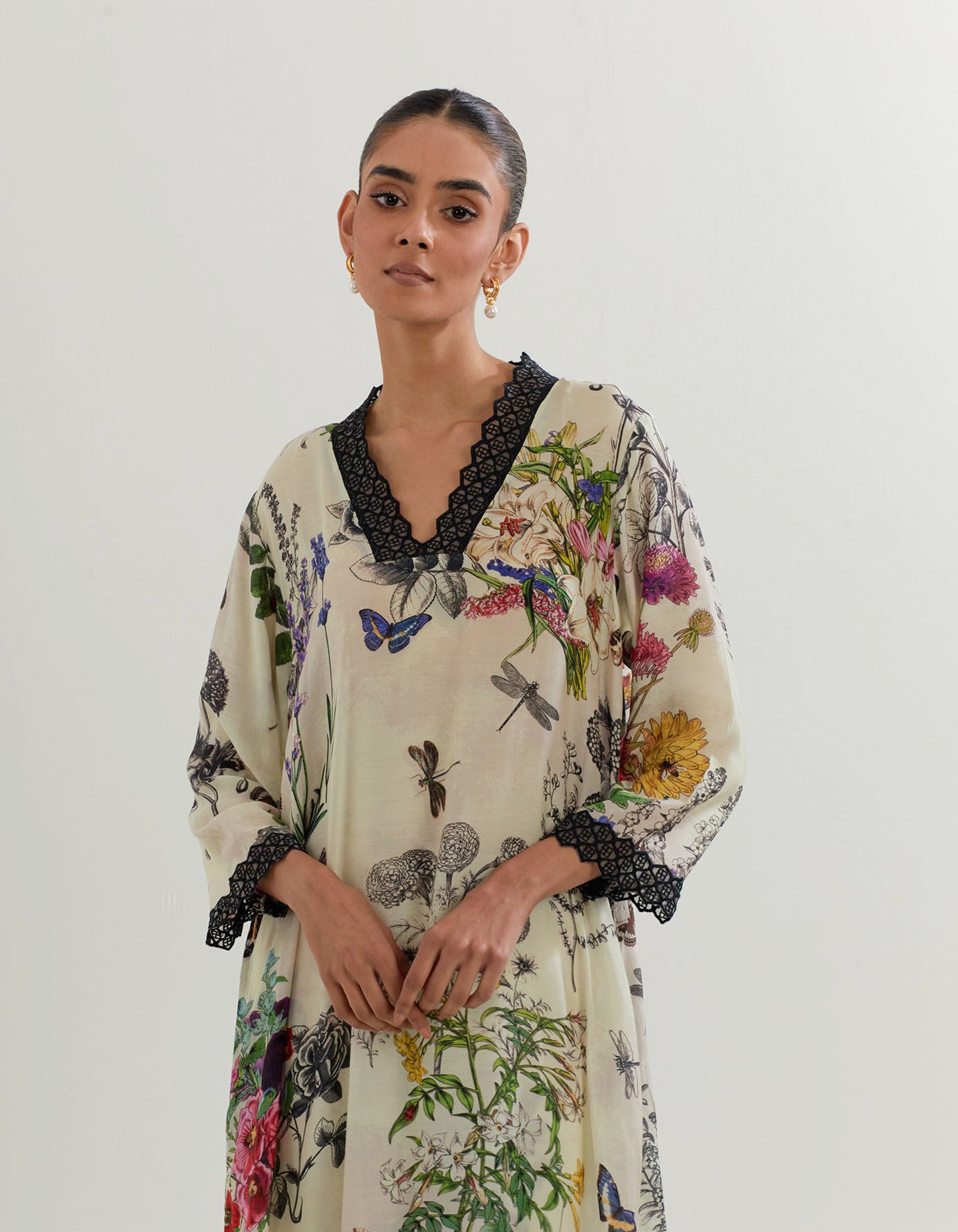 Botanical silk kurta with resham embroidered details paired with printed pants