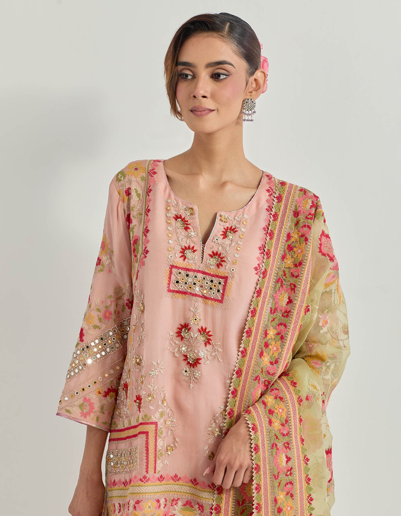 Tissue chanderi kurti and sharara in cross stitch and mirror work embroidery paired with organza silk embroidered dupatta