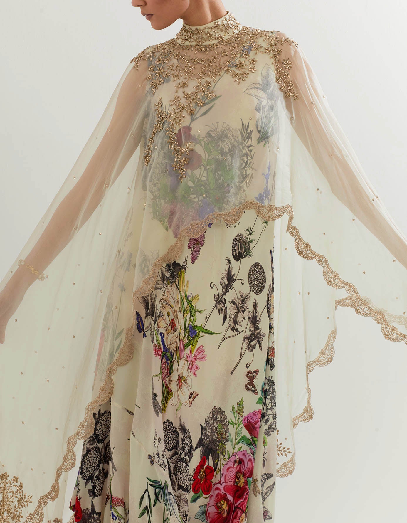 Botanica printed cowl dress paired with organza hand embellished cape