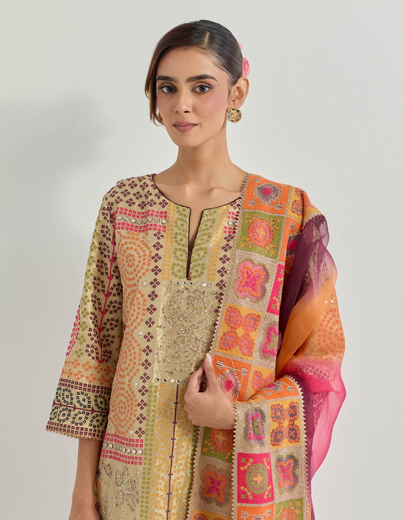 Resham and hand embellished kurta in tiisue paired with stretch lycra pants and organza silk tie dye dupatta