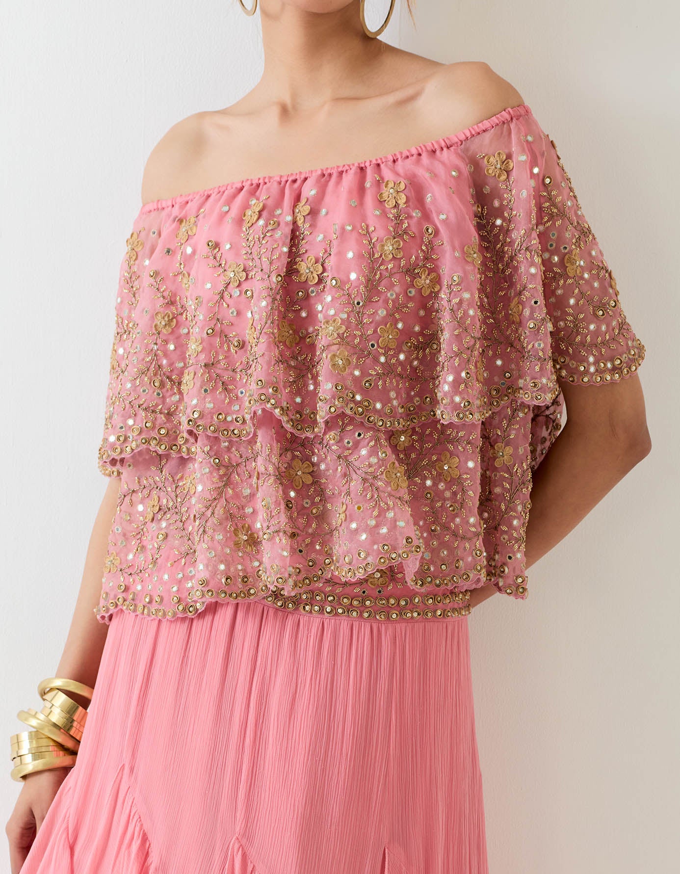 Off shoulder organza hand embellished cape paired with chiffon ruffle skirt