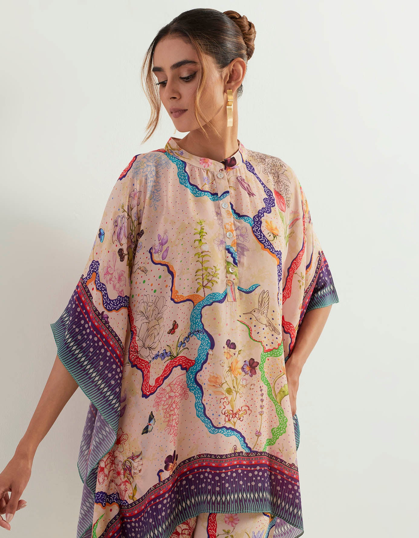 Eclectic printed poncho with heavy georgette pants