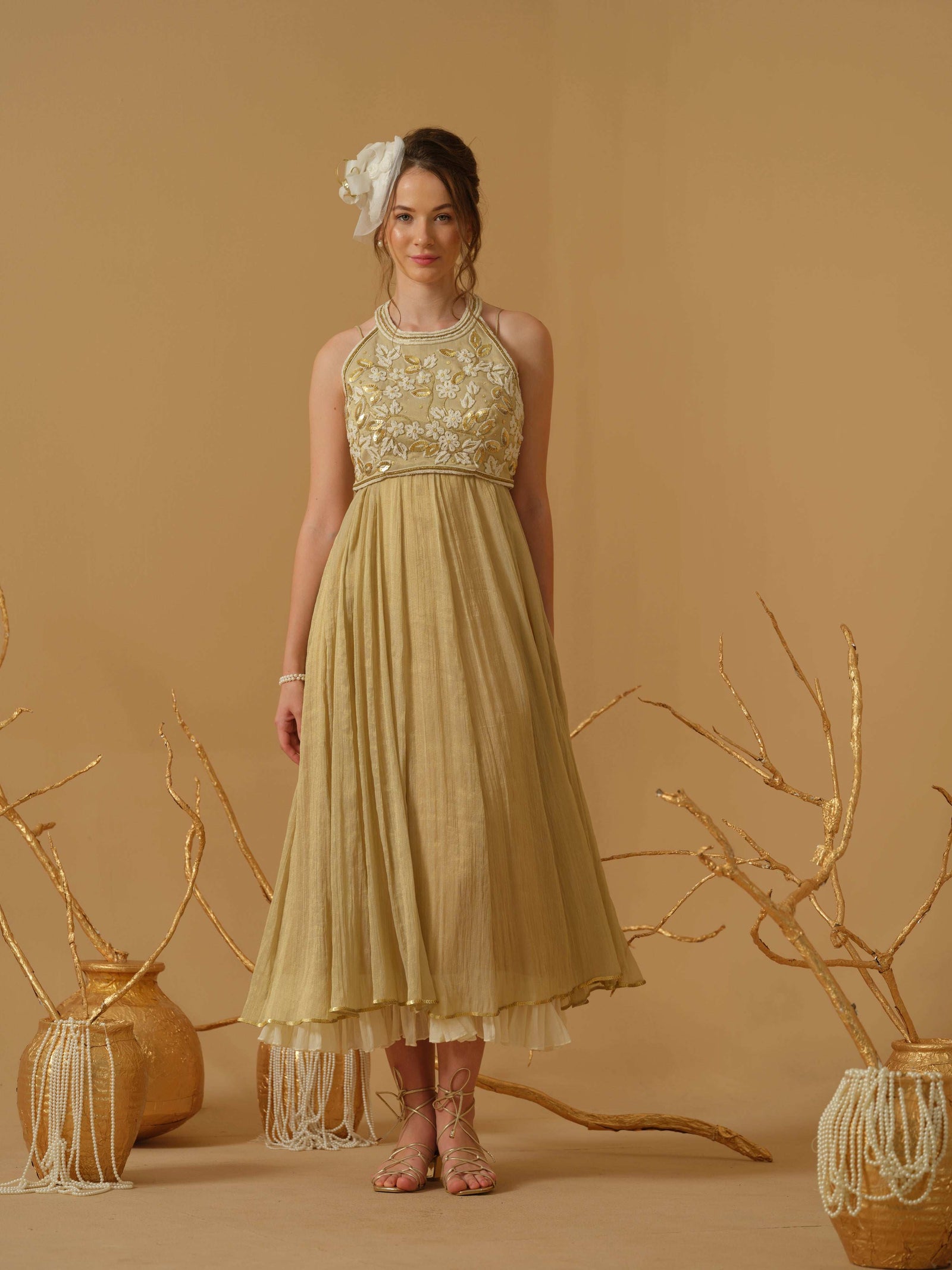 A Noodle Strap, Calf Length Flared Dress Having A Sequins Line
