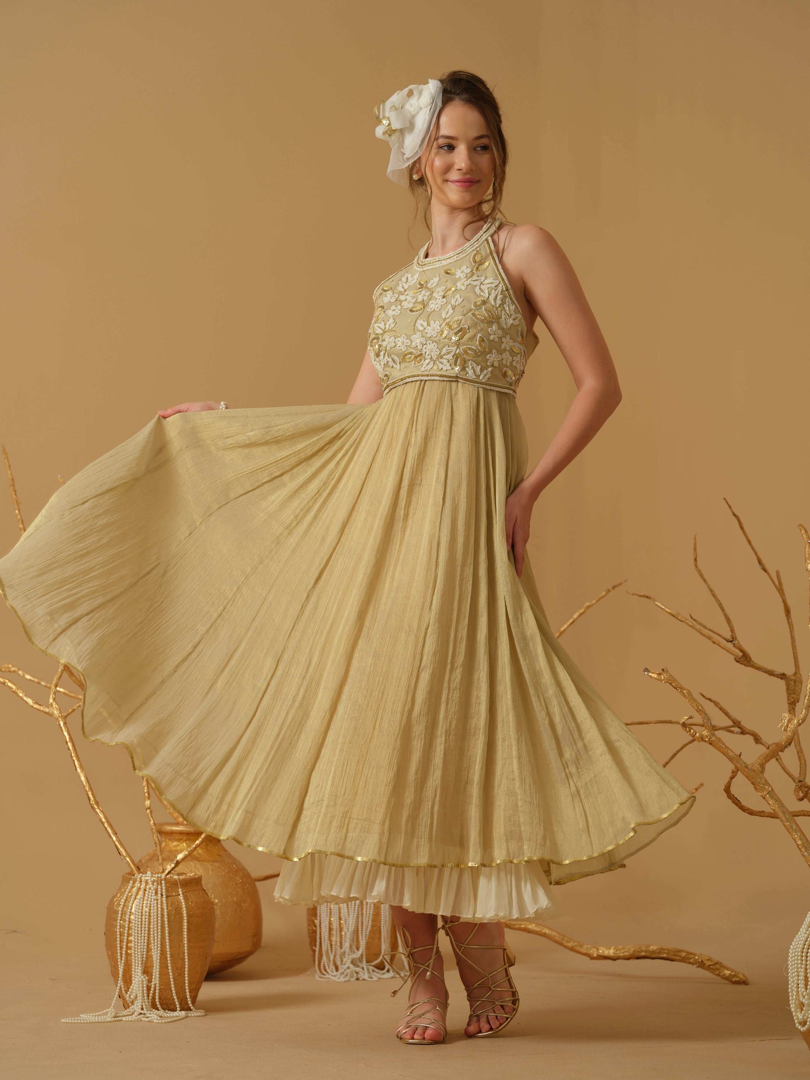 A Noodle Strap, Calf Length Flared Dress Having A Sequins Line