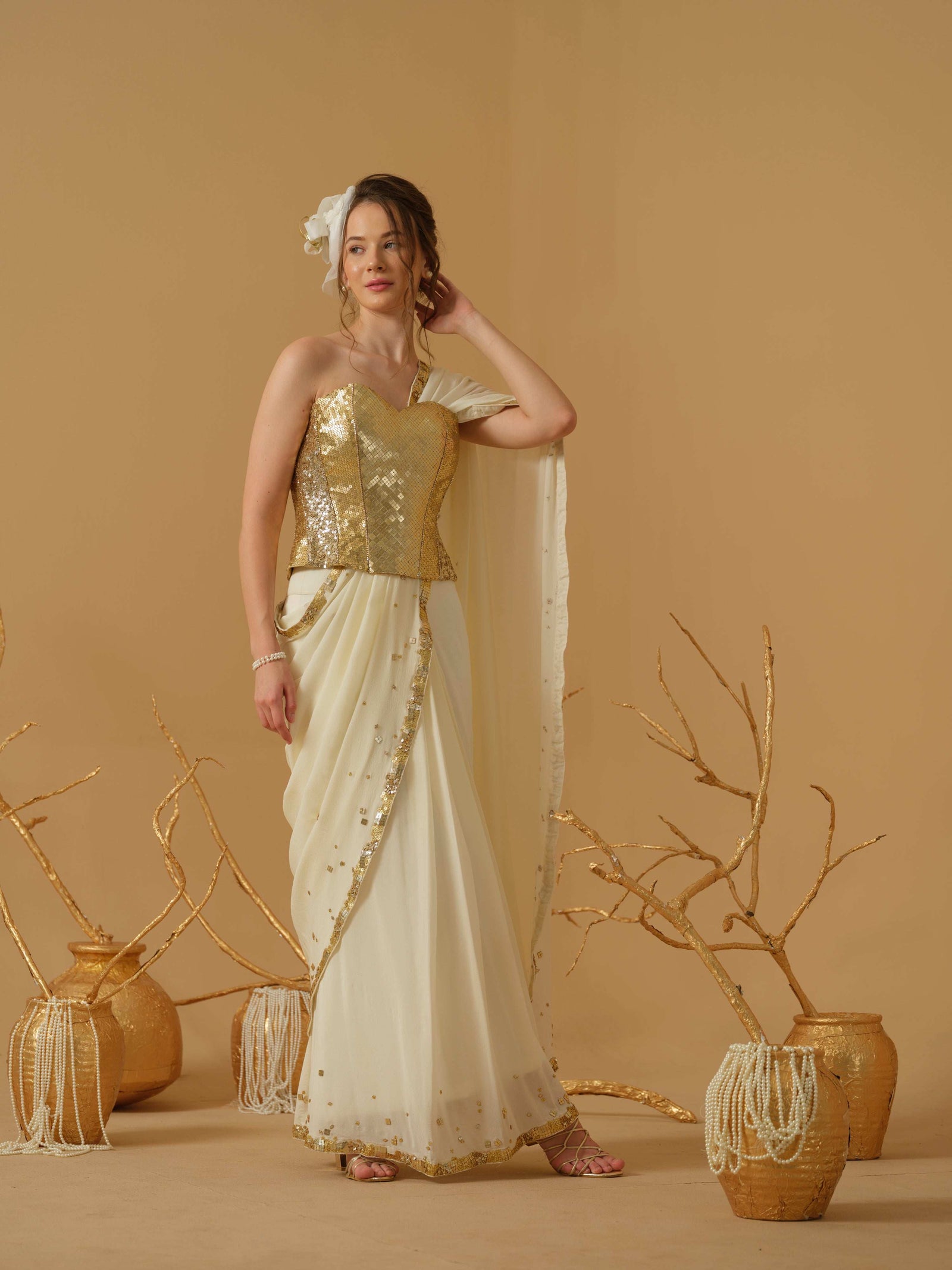 A Pre-Stitched Saree With A Geometrical Sequins Border Paired With A Heavily Embellished Corset