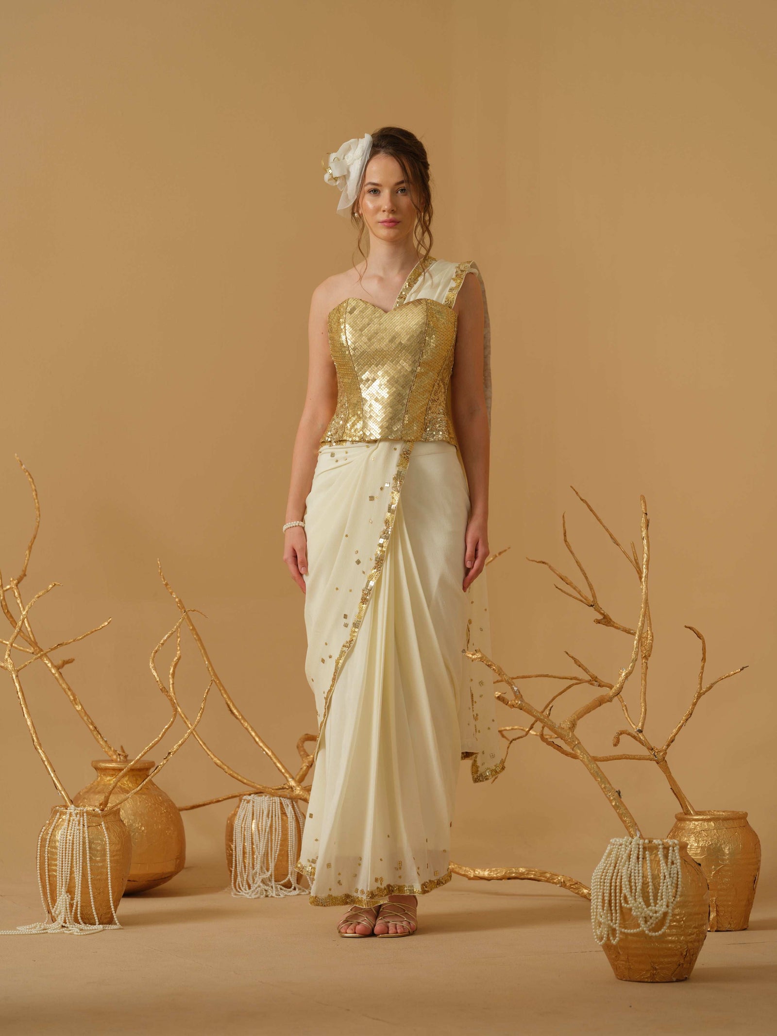 A Pre-Stitched Saree With A Geometrical Sequins Border Paired With A Heavily Embellished Corset