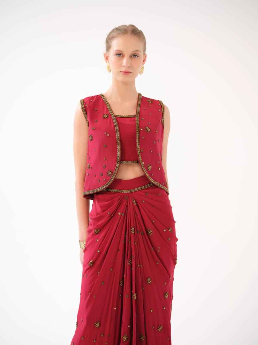 A three-piece set — jacket, bustier, and drape skirt