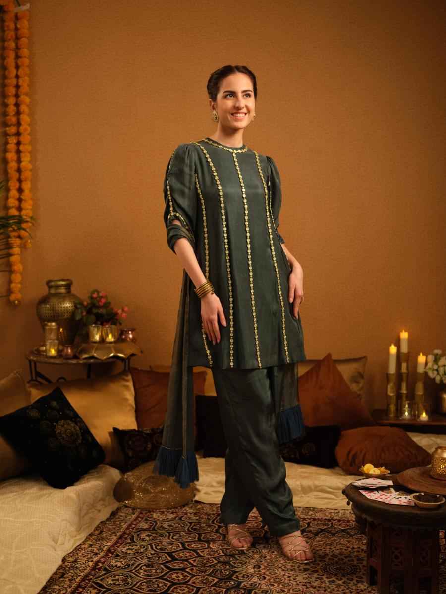 A twill kurta with gold bead embroidery