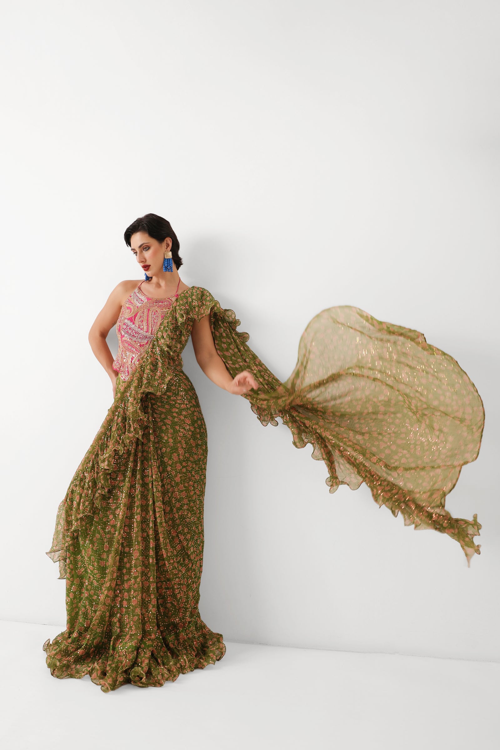 The Ezra Jhilmil saree set in avacado green with rani ambi blouse