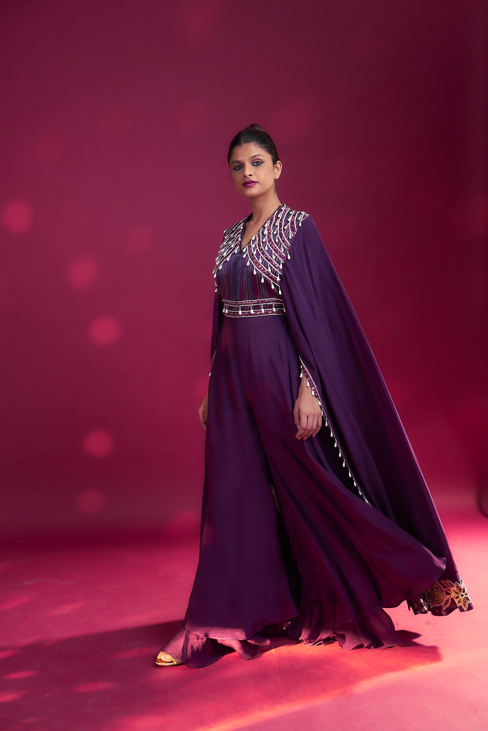 Purple heavily embellished jumpsuit wiwth embroidered cape sleeves