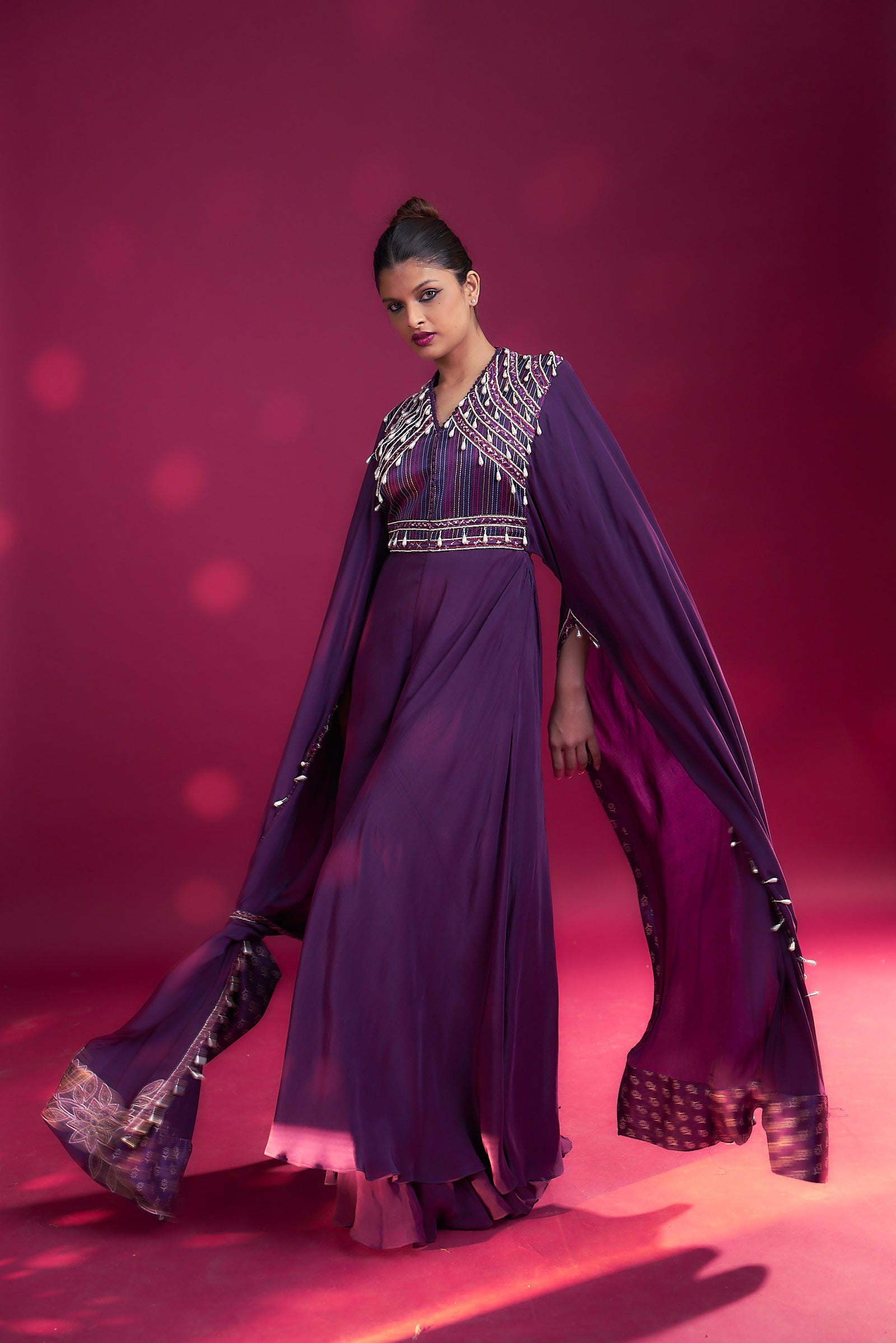 Purple heavily embellished jumpsuit wiwth embroidered cape sleeves