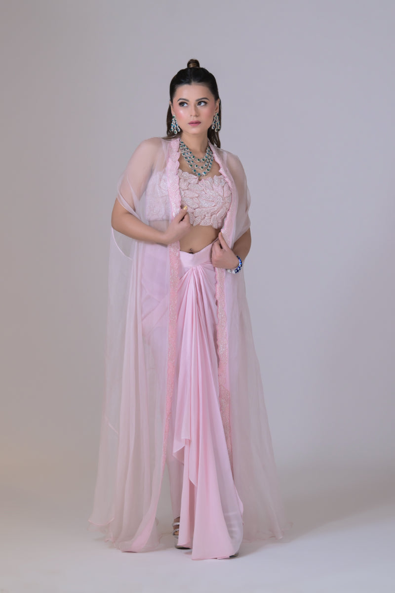 A pink organza cape and a crop blouse