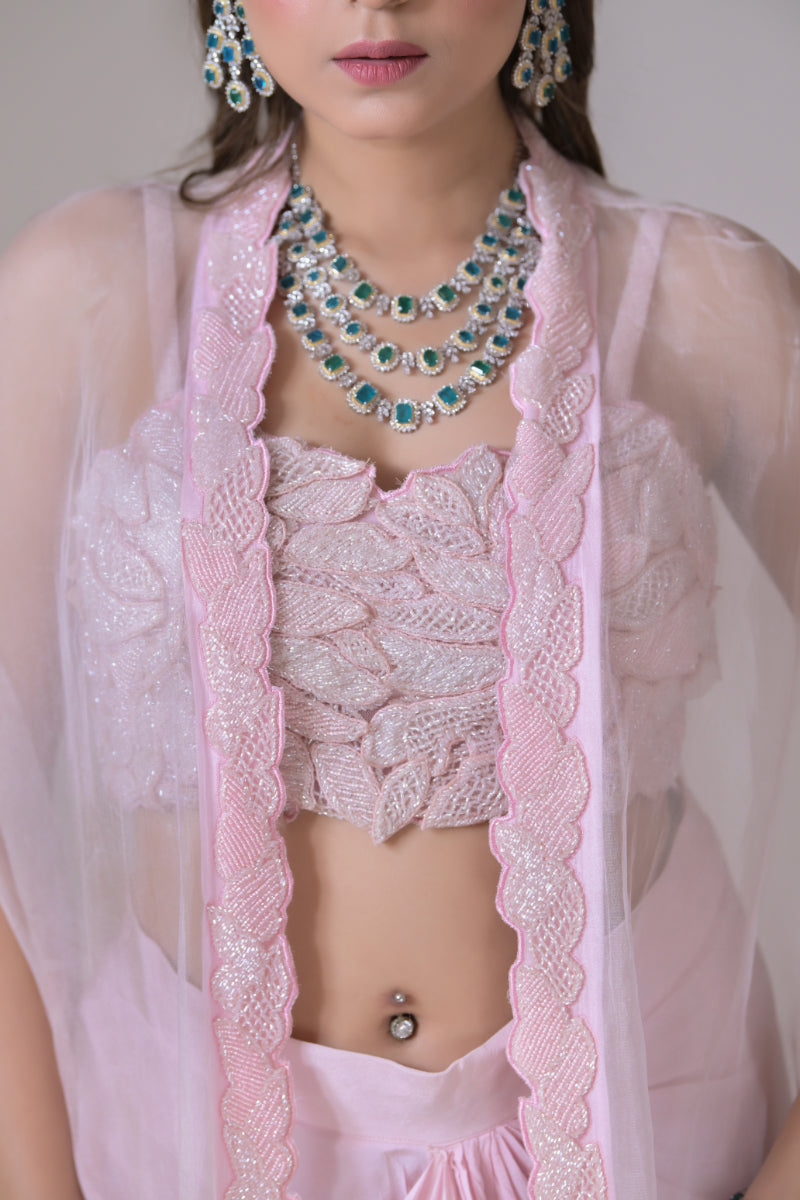 A pink organza cape and a crop blouse